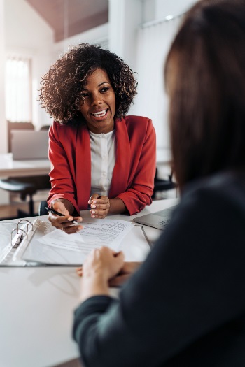 Two of people discussing business at a table