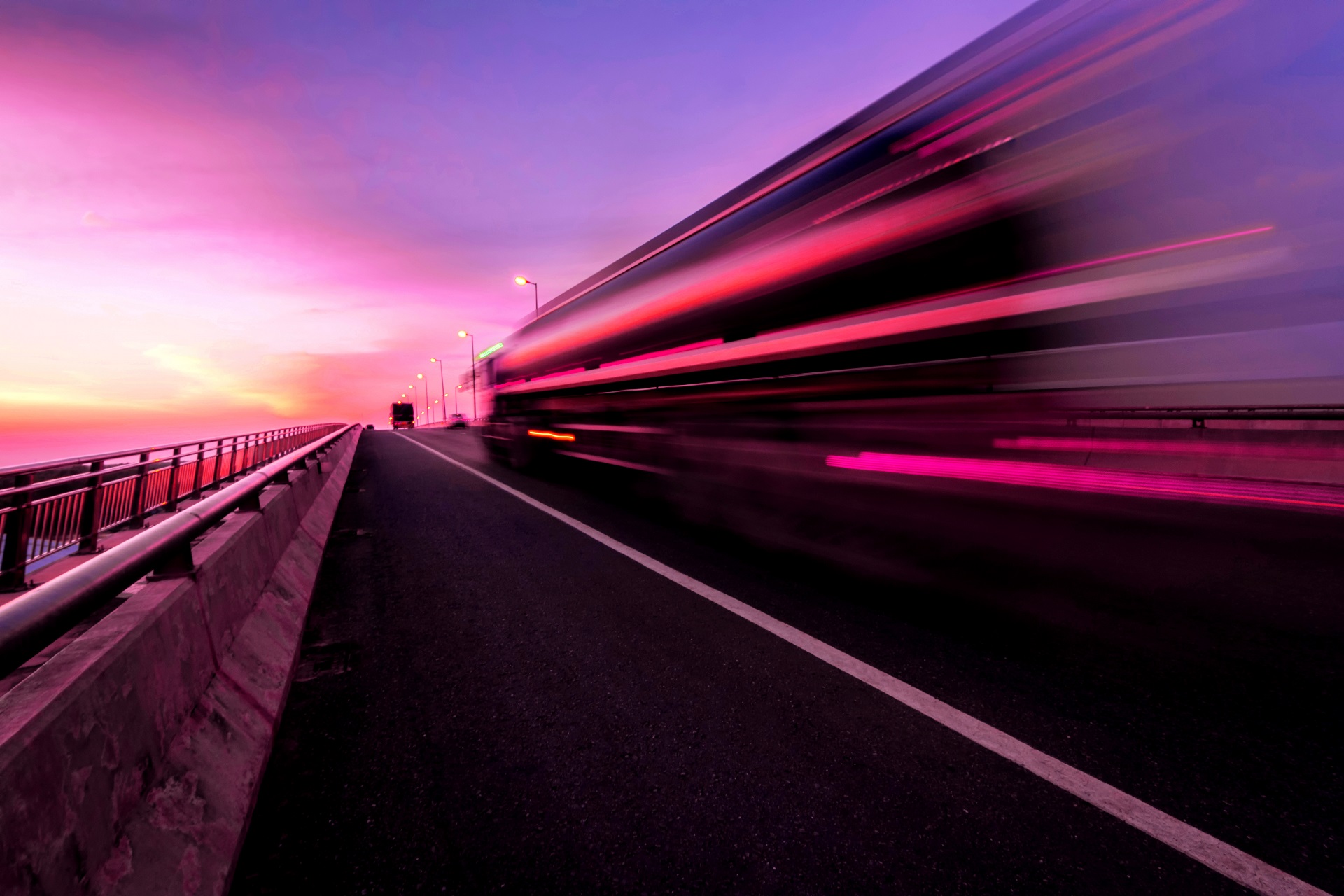 A large commercial vehicle driving on the road ahead